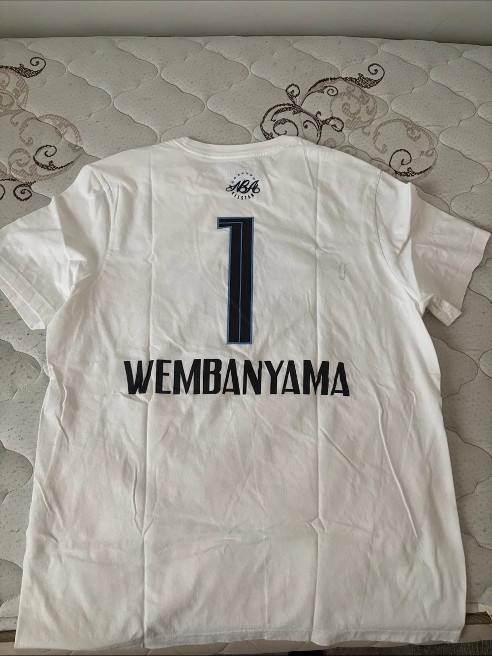 Jordan White Tee with Blue and Black World All-Stars Graphic Wemby shirt